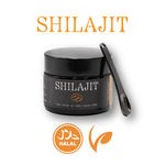 Black jar of Shilajit with a metal scoop on a white background, featuring 'Shilajit' text and halal certification logos.